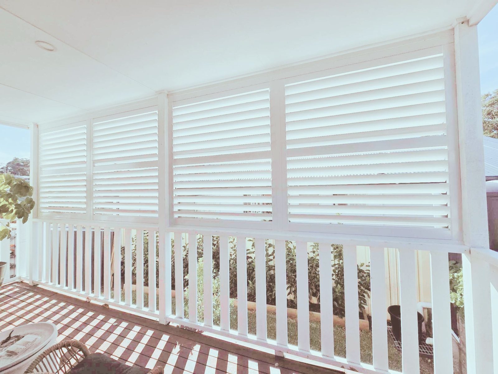 White aluminium shutters on a verandah in Kotara
