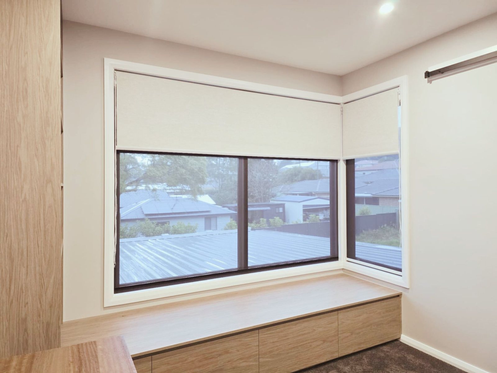 Roller blind on a corner window in Murrays Beach