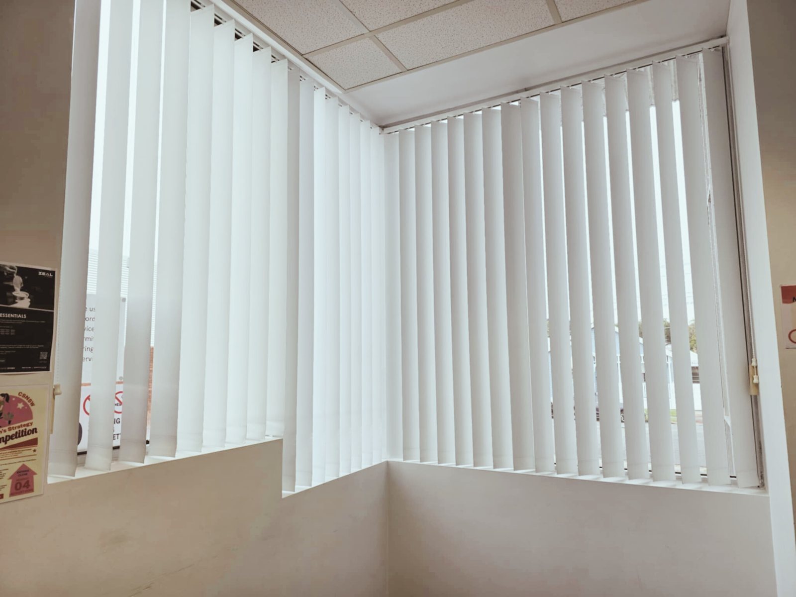 White vertical blinds on a corner window in Cardiff